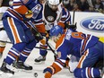 Griffin Reinhart during his time with the Edmonton Oilers, getting down and dirty to defend a dastardly Duck.