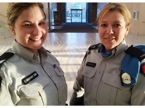 Edmonton Police Service (EPS) Cst. Nathalie Perrault, right, and Sgt. Colleen Mooney pose for a photo following an Edmonton Police Commission meeting at City Hall in downtown Edmonton, AB on Thursday, March 17, 2016. Perrault and Mooney traveled to Haiti and Ukraine in 2015 as part of the EPS international deployment program in partnership with the RCMPís International Liaison and Deployment Centre (ILDC). TREVOR ROBB/Postmedia Network