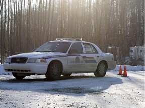 RCMP investigate a triple homicide at a rural property east of Edson, Alberta, approximately 200 kilometres west of Edmonton, in 2015.