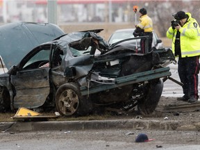 Police investigate at the scene of a fatal car crash along northbound Manning Drive near 50 Street in Edmonton on Sunday, March 13, 2016.