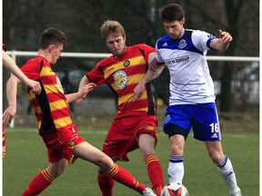FC Edmonton forward Daryl Fordyce battles a pair of opponents for a ball during a game against Partick Thistle on Sunday, the first in a series of friendlies in Scotland. (Tommy Taylor, Partick Thistle FC) ORG XMIT: *EDI*