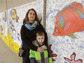 Elvira Berezowsky and her son Carver, 7, outside Afton Elementary School in Edmonton on March 3, 2016. She is concerned the school, which has a specialized arts program, might lose it in a potential consolidation.