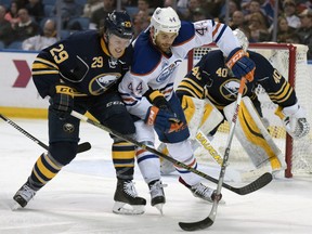 Buffalo Sabres defenseman Jake McCabe (29) vies for the puck with Edmonton Oilers right winger Zach Kassian (44) during the second period of an NHL hockey game Tuesday, Mar. 1, 2016, in Buffalo, N.Y.