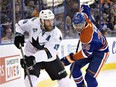 San Jose Sharks' Joe Thornton (19) is chased by Edmonton Oilers' Darnell Nurse during NHL action in December 2015.
