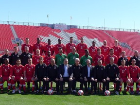 Members of the Canadian men's national soccer team and staff pose for a team photo at BMO Field in Toronto, Monday, Sept.8, 2014. The team faces Jamaica in a friendly match on Tuesday.