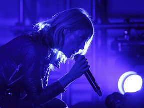 Emily Haines of Metric performs at Rexall Place in Edmonton, Alta., on Tuesday March 29, 2016 during a tour in support of their latest release Pagans in Vegas.