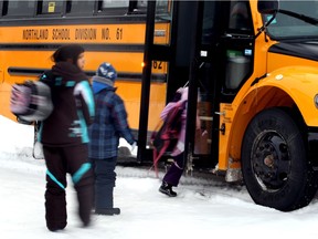 Northlands School district students board the bus at Sandy Lake's Pelican Mountain School in this 2010 file photo.