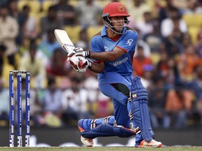 Afghanistan's Najibullah Zadran prepares to play a switch-hit during their ICC World Twenty20 2016 cricket match against West Indies' in Nagpur, India, Sunday, March 27, 2016.