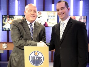 NHL Deputy Commisioner Bill Daly congratulates Edmonton Oilers Assistant General Manager Bill Scott on the 1st overall pick at the National Hockey League Draft Lottery on April 18, 2015 at the Sportsnet Studios in Toronto, Ontario, Canada.