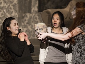 From left to right, Angelina Salvador as Barbra, Rosario Gumapac as Betty, and Moia Calkins as a zombie  in Holy Trinity High School's production of Night of the Living Dead Live!