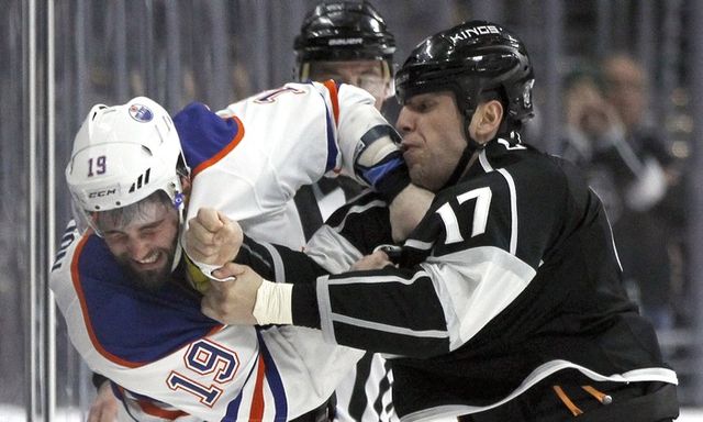 Edmonton Oilers left wing Patrick Maroon (19) and Los Angeles Kings left wing Milan Lucic (17) fight during the second period of an NHL hockey game in Los Angeles, Saturday, March 26, 2016.