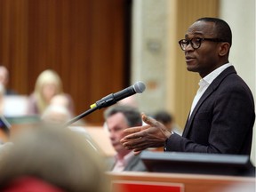 Professor Ubaka Ogbogu, with the Faculty of Law at the University of Alberta, speaks to a packed room Wednesday as part of a panel discussion on physician-assisted death.
