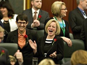 Alberta Premier Rachel Notley has a laugh before the delivery of the Speech from the Throne, in Edmonton Alta, on Tuesday March 8, 2016.