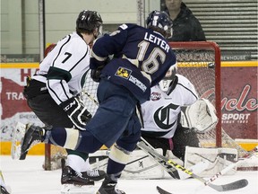 Spruce Grove Saints Colton Leiter scores on Sherwood Park Crusaders goaltender Zach Dyment at the Sherwood Park Arena during game 3 of the their best-of-seven AJHL North Division semifinal on March 21, 2016 .