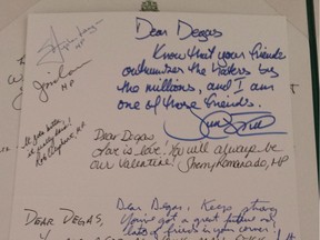 Signatures of various members of parliament and the Prime Minister, top right, adorn a booklet sent to Degas Sikorski, a St. Alberta man who received a Valentine at work last month that was defaced with a homophobic message.