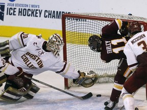 Boston College's Thatcher Demko (30) makes a save with seconds left in the third period of the NCAA men's northeast regional championship hockey game against Minnesota-Duluth in Worcester, Mass., Saturday, March 26, 2016. Boston College won 3-2.