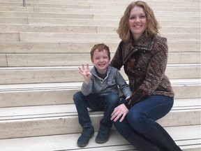 Dawn Newton and her four-year-old son Elliot at City Hall. Newton spoke in support of the city's new daycare policy.