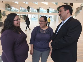 Wicihitowin supporters debrief after Monday's community services committee meeting. Interim CEO Sheldon Hughes (right) says the smiles in this photo reflect the organization's optimistic attitude about Wicihitowin's future. Also pictured are board chairwoman Aretha Greatrix (left) and board member Sara Cardinal (centre).