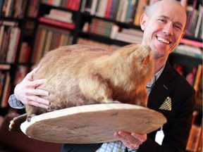 Todd Babiak, who thinks his books might be too Canadian for American readers, brandishes a stuffed beaver as he celebrates his latest novel, Son of France. The sequel to his thriller, Come Barbarians, is out Monday.