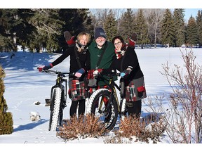 Jan Wallace, centre, and Jenn Mikula pose with Nick Lees to show off their line of tartan bike skirts and shorts, a fundraiser for troubled youth.