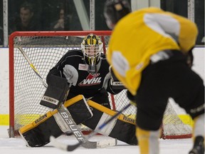 Goaltender Jordan Papirny makes a save during a Brandon Wheat Kings practice at Clareview Recreation Centre in Edmonton on March 29, 2016.