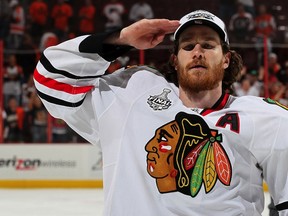 PHILADELPHIA - JUNE 09: Duncan Keith #2 of the Chicago Blackhawks salutes after the Blackhawks defeated the Philadelphia Flyers 4-3 in overtime and win the Stanley Cup in Game Six of the 2010 NHL Stanley Cup Final at the Wachovia Center on June 9, 2010 in Philadelphia, Pennsylvania.   Jim McIsaac/Getty Images/AFP