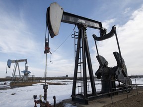 Idle oil pump jacks are seen in a field near Leduc on Friday, March 4, 2016. Historically low prices have caused a drastic slowdown in the oil business in Alberta.