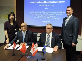 Edmonton Coun. Ed Gibbons and Jack Yang, CEO of Can-China Global Resource Fund, sign a memorandum of understanding during a recent trip to China.