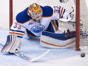 Edmonton Oilers goalie Cam Talbot stops a Vancouver Canucks shot during the second period of an NHL hockey game in Vancouver, B.C., on Saturday April 9, 2016.