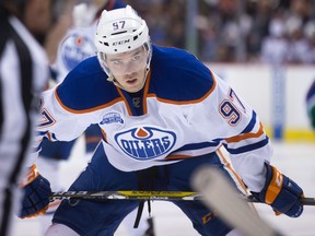 Edmonton Oilers' Connor McDavid lines up for a faceoff against the Vancouver Canucks during the first period of an NHL hockey game in Vancouver, B.C., on Saturday April 9, 2016.