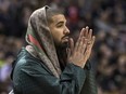 Rapper Drake watches second half NBA basketball action as Toronto Raptors take on Portland Trail Blazers in Toronto on Friday March 4, 2016.