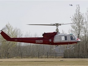 Two helicopters and 25 firefighters were fighting a brush fire near Duffield, Alta., a hamlet located west of Edmonton, on April 18, 2016.