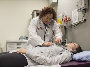 Nurse practitioner Francene Fahey treats  Rachel Krumpholz on Tuesday at Canada's first nurse practitioner-led outpatient trauma clinic at the Kaye Edmonton Clinic across from University Hospital.