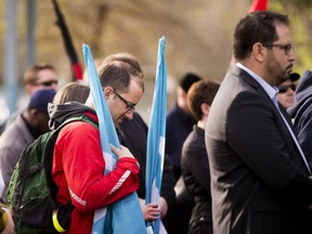 People take part in a Day of Mourning ceremony hosted by the Edmonton and District Labour Council to recognize those workers killed and injured on the job.  The event was held  Thursday, April 28, 2016, at the Broken Families Obelisk at Grant Notley Park.