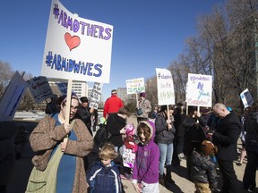 People take part in a rally organized by the Association for Safe Alternatives in Childbirth outside the Alberta legislature March 9. The group lobbied for a change in the funding of Alberta's midwife program.