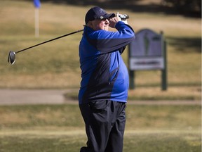 Wayne Sayler hits his golf ball on the first hole as he plays his first round of golf for the year at Victoria Golf Course which opened Friday.