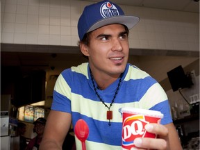 EDMONTON, ALBERTA ; AUGUST 14, 2014-- Dairy Queen Canada and Edmonton Oilers forward Nail Yakupov serve up Blizzard Treats to fans for the 12th annual Miracle Treat Day in Sherwood Park, in support of Children's Miracle Network. Miracle Treat Day is a one-day, national fundraising event that donates 100 per cent of proceeds from all Blizzard Treats sold to Children's Miracle Network. This year, participating Dairy Queen locations across Canada will celebrate the 12th anniversary of Miracle Treat Day and the company's 30 year partnership with Children's Miracle Network. on August 14, 2014 in Edmonton.   Dairy Queen has become a top contributor to Children's Miracle Network, with $100 million raised to-date in support of sick and injured children across North America. (Greg Southam/Edmonton Journal)