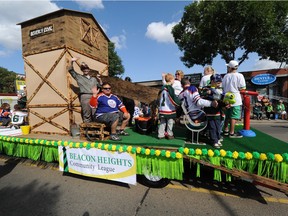 The Beacon Heights Community Float takes part during the Beverly Centennial Parade in Edmonton on Saturday Aug. 23, 2014.