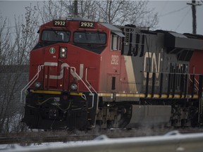 EDMONTON ALBERTA, DECEMBER 14, 2015: A container train rumbles down the rails on the CN main line in the west end in Edmonton on Monday Dec. 14, 2015. (photo by John Lucas/Edmonton Journal)