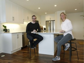 Home owner Jay Palmer (left) had his condo renovated with help from designer Angelique Case (right) at his Creekside Condominium home in south Edmonton.