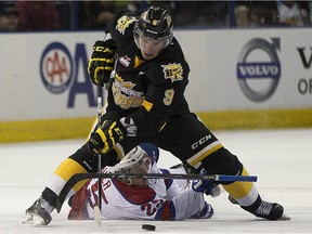 EDMONTON, ALBERTA ; MARCH 31, 2015-- Edmonton Oil Kings Lane Bauer can't get the puck from Brandon Wheat Kings Ivan Provorov during game 4 of the first round of the WHL playoffs on March 31, 2015 in Edmonton.   (Greg Southam/Edmonton Journal)