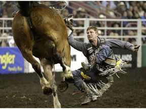 Airdrie's Jake Vold gets bucked off in the bareback event of the 2015 Canadian Finals Rodeo on November 14, 2015. (File)