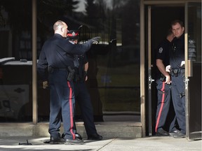 Police at the scene of a shooting at an apartment building in west Edmonton on April 17, 2016.