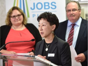 Alberta Health Services Dr. Verna Yu is flanked by Health Minister Sarah Hoffman and Infrastructure Minister Brian Mason to announce a $759.5-million maintenance and renewal of Alberta's health-care facilities at a University Hospital news conference in Edmonton, April 22, 2016.