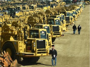 Potiential bidders at Ritchie Bros. heavy equipment auction site, expected to be the company's biggest Canadian auction which started Tuesday, April 26, 2016, in Nisku.