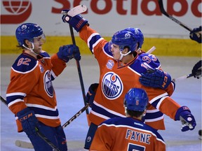 Edmonton Oilers Nail Yakupov (10) celebrating his goal with teammates against the Vancouver Canucks during NHL action at Rexall Place in Edmonton, April 6, 2016.