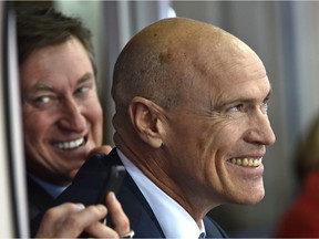 Former Edmonton Oilers Mark Messier and Wayne Gretzky watch the final NHL game at Rexall Place on Wednesday, April 6. (Ed Kaiser)
