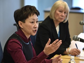 Dr. Verna Yiu, interm AHS CEO (left), says in a letter to the editor that critics are wrong to claim the provincial health authority is top-heavy with managers. Yiu is pictured at a January 2016 meeting with AHS board chairwoman Linda Hughes.