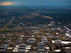 An aerial view of the Imperial Oil Strathcona refinery with the Kinder Morgan and Enbridge oil terminals in the foreground and the Edmonton skyline in the background in 2011. The area is part of Alberta's Industrial Heartland.