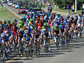 The peloton of cyclists head through the streets of Leduc during stage 2 of the Tour of Alberta in 2013.